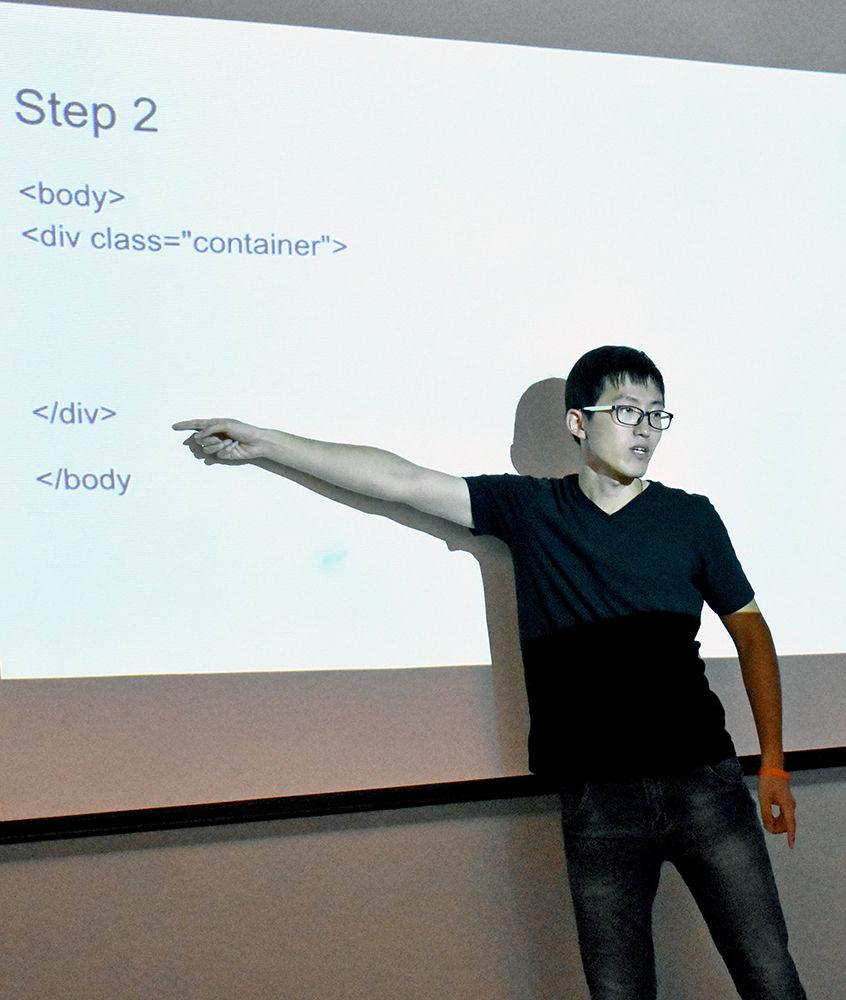 Graduate research assistant Yihuan Dong goes through the coding process and explains how to create a body template during the engineering summer day camp. The camp was held in Engineering Building II on Centennial Campus and went from June 26-30.