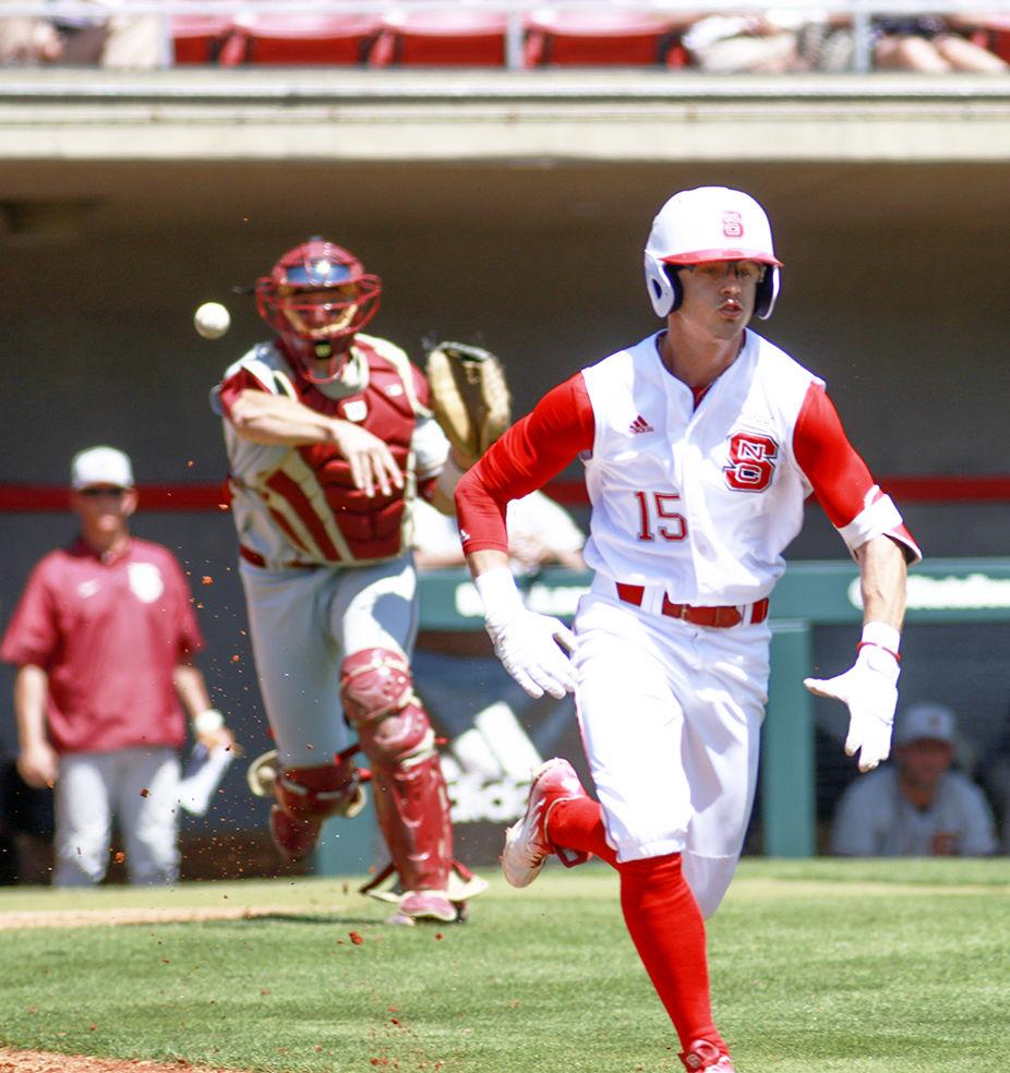 Junior center fielder Josh McLain sprints down the third base line as Florida State catcher Cal Raleigh picks up the bunted ball and throws it to first base for the out in the Wolfpack's 8-4 win on April 9 at Doak Field. McLain was selected by the Los Angeles Dodgers in the 14th round of the 2017 MLB Draft, but has elected to return to NC State next season.