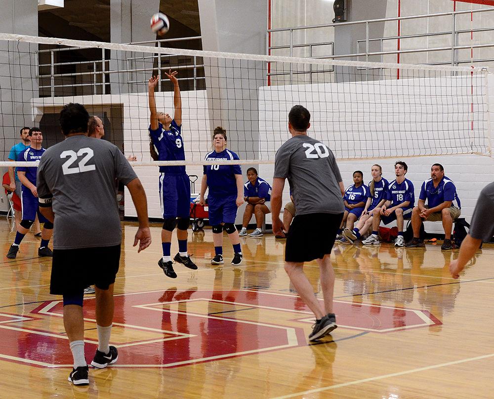 Elizabeth Kellum from Onslow County hits the ball over the net in a volleyball match between her team the Onslow County Block and Roll and the Cumberland County Troublemakers at Carmichael Gymnasium as part of the Special Olympics Saturday, Jun 3 2017. Volleyball was among several events taking place on campus during the Special Olympics Summer Games. The Olympics allow those with disabilities across North Carolina the chance to compete in various sporting events.. Kellum's team lost to the Troublemakers with the final score being 25 to 22.