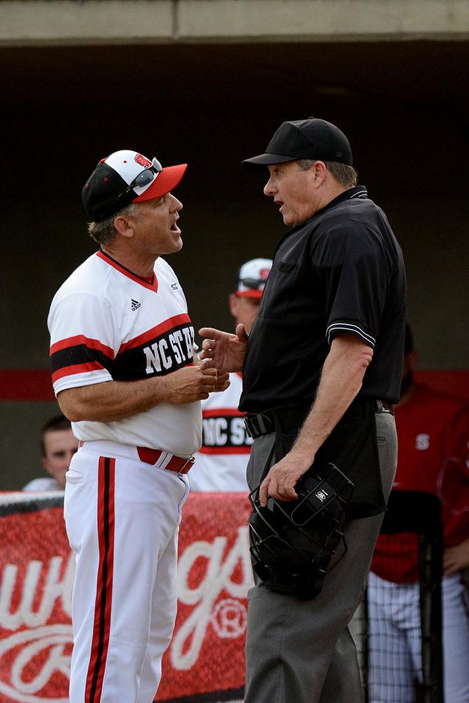 Head coach Elliot Avent discusses a play with the umpire. The NC State baseball team lost to Indiana State 7-11 at Doak Field at Dail Park on March 16.