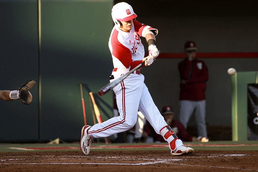 Junior third baseman Evan Mendoza crushes a pitch that sailed for a home run in the Wolfpack's game against Florida State on April 8 at Doak Field.