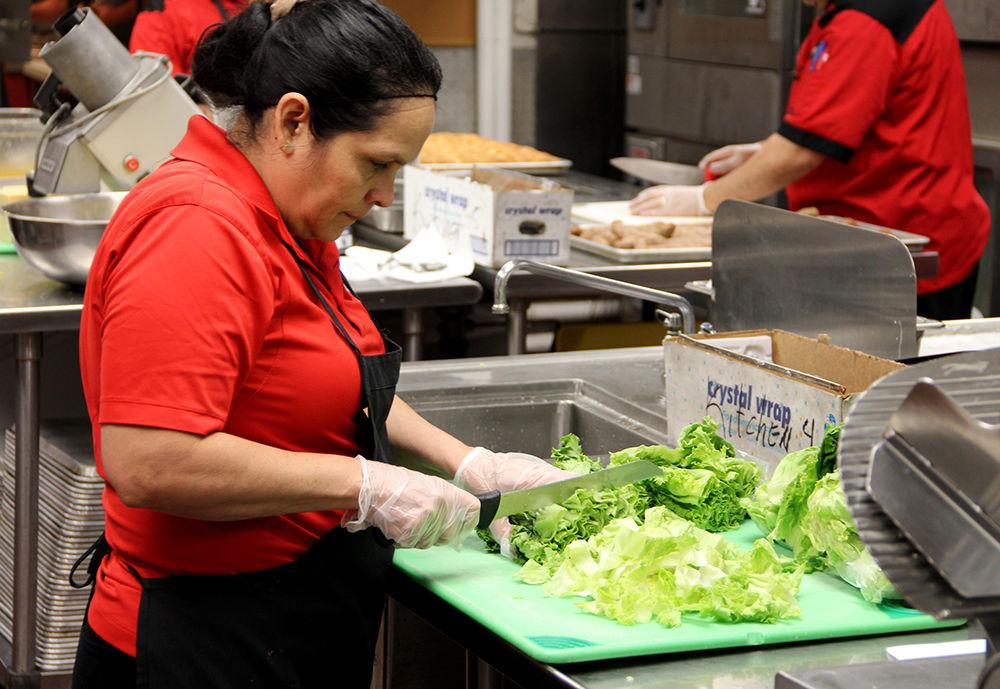 Diamantina Argueta, 49, prepares ingredients in the morning for the upcoming dinner service as part of the morning kitchen staff.