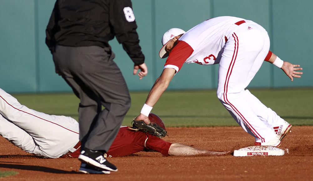 Junior short stop Joe Dunand tags out a Florida State runner at second base as he dives back to the bag in their game on April 8, 2017 at Doak Field.