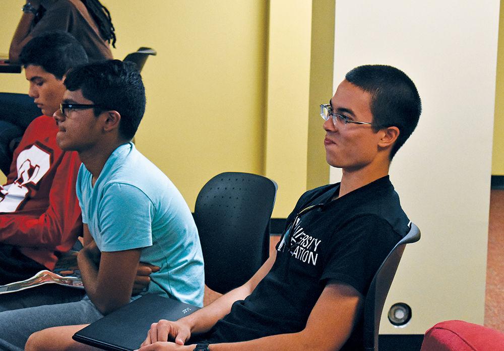 Summer START freshmen, Joshua Schmidt (right) and Vishaal Pillai (left), enjoy learning about the various behaviors of cultures around the world during the Crossing Cultures program. The program was put on by the Global Training Initiative for START participants on Wednesday, July 5.