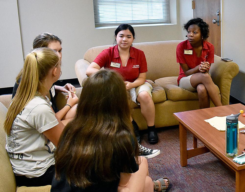 Peer mentors Megan Wong and Maya Davis answer questions from Summer START classes during the classmate meetup social on Sunday, June 25. The classmate social took place in the basement lounge of Tucker Residence Hall and provided Summer START participants with a place to find out information about the classes they were taking and form study groups with other students.&#160;