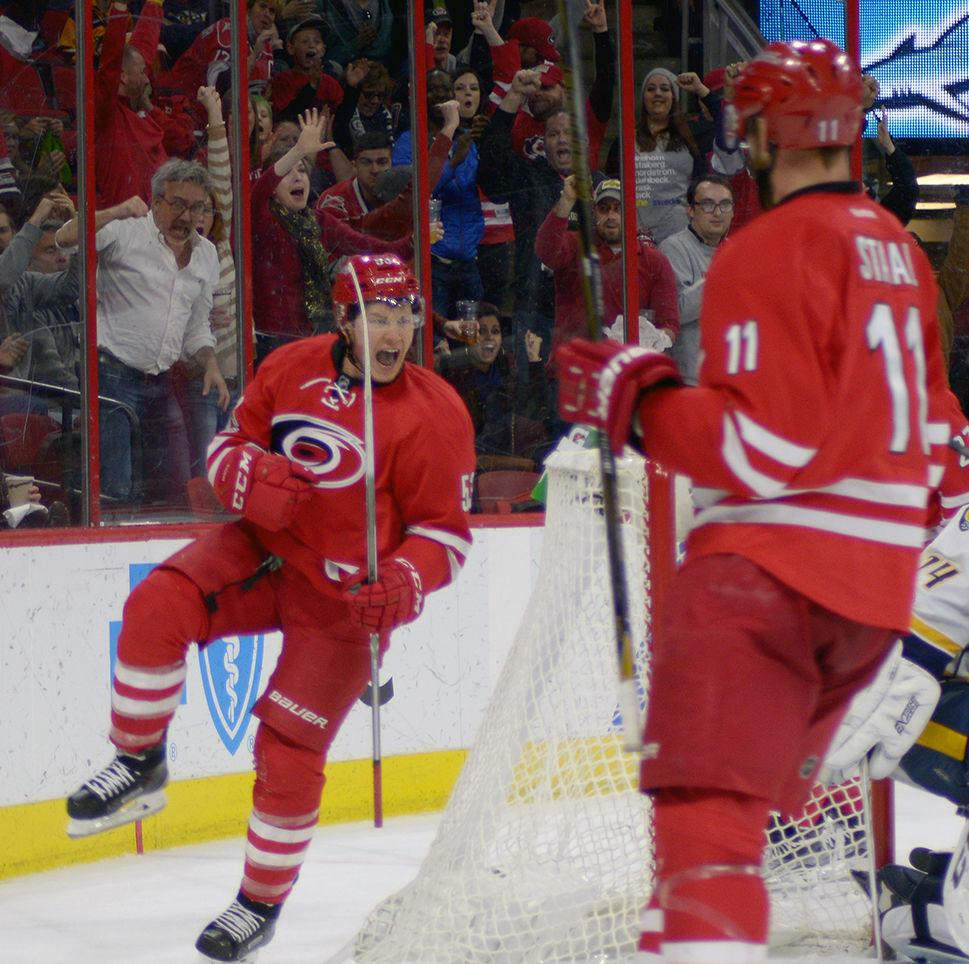 Hurricanes forward Jeff Skinner celebrates his second goal of the night in the second period off an assist from forwards Jaccob Slavin and Jordan Staal. Skinner recorded two goals in the Hurricanes' 4-2 victory over the Nashville Predators in PNC Arena on March 18.