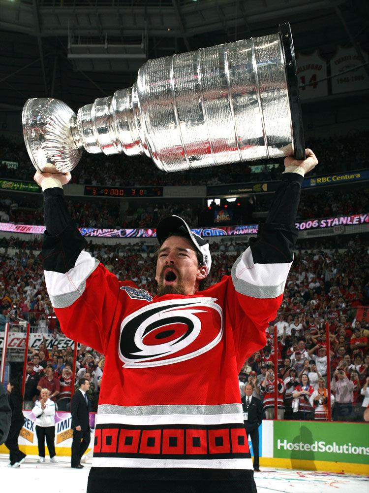 Justin Williams lifts the Stanley Cup after the Carolina Hurricanes' 3-1 victory over the Edmonton Oilers in game seven June 19, 2006. Williams signed a two-year, 9 million contract to return to Carolina on July 1, 2017.