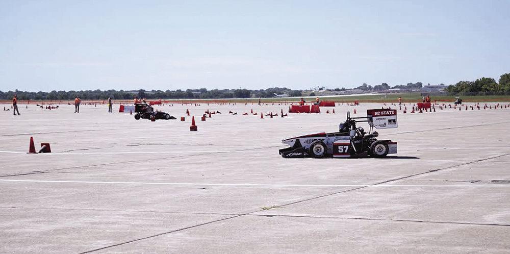 Former team captain Collin Walther drives a car designed by Formula SAE at FSAE Lincoln Endurance, one of several events the group competes in each year. Members of SAE work to build five different subsystems for a car: chassis, suspension, aerodynamics, powertrain and electronics.