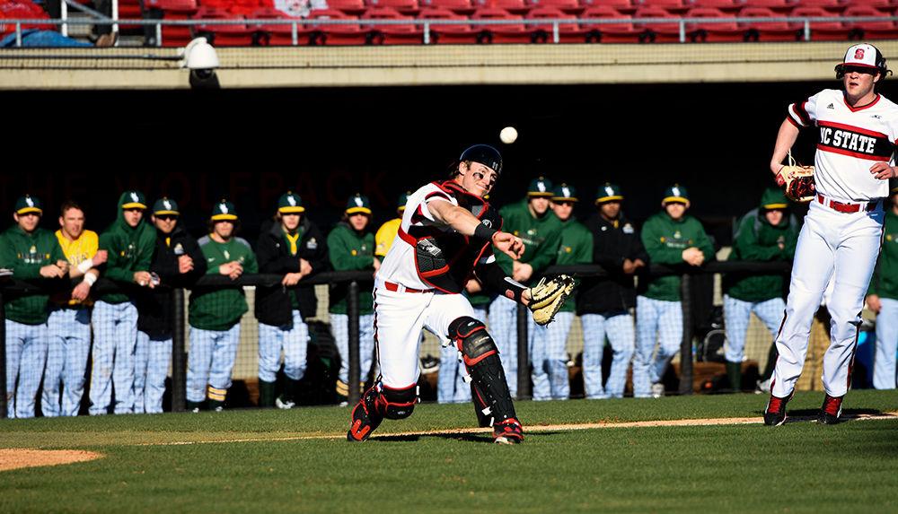 Junior catcher Andrew Knizner fires off a throw to first base after a Wright State batter bunted the ball in the Wolfpack's 8-10 loss on February 26, 2016. Knizner posted 1 run and 1 hit in the loss at Doak Field.