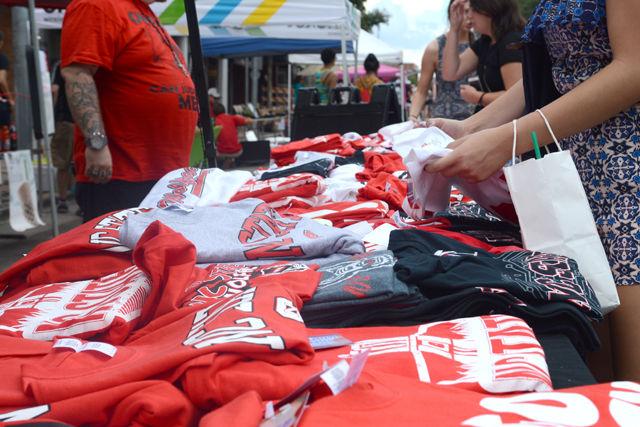 Vendors along Hillsborough St. put out merchandise, such as NC State shirts, at Packapalooza on Aug. 20.