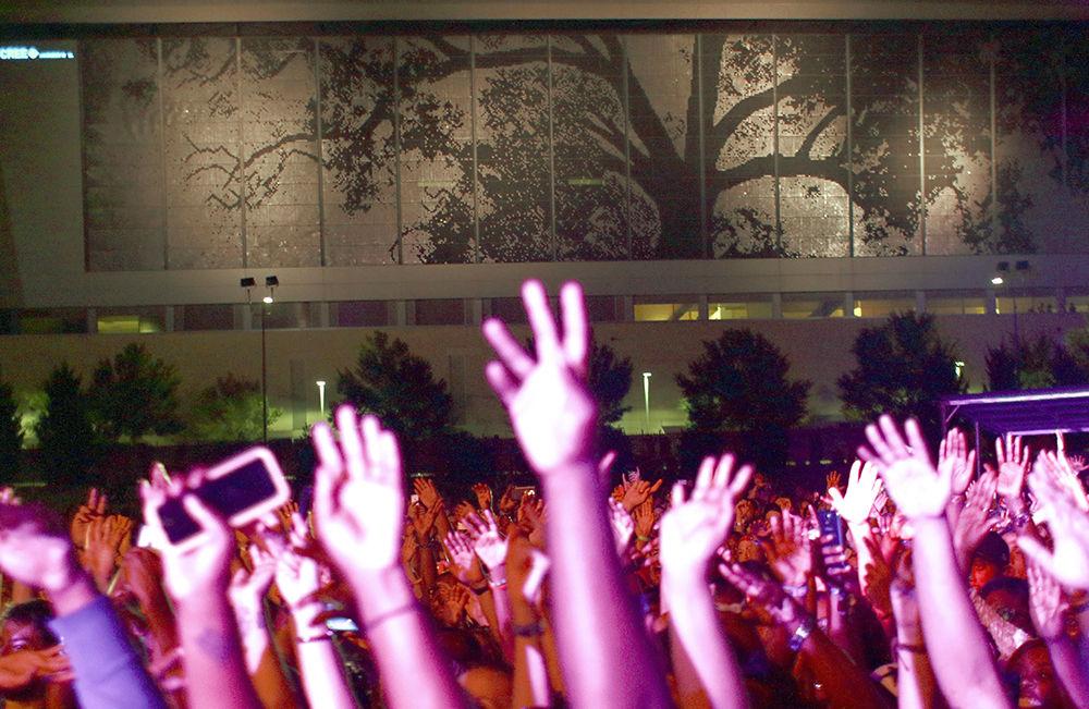 The crowd throws their hands in the air during Erykah Badu's performance at Red Hat Amphitheater for Hopscotch Music Festival on Sept. 9, 2016.&#160; Badu's plane was delayed and she ended up taking the stage about 2 hours late.