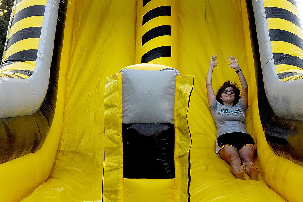 Mel Vandenberg a first-year studying zoology goes down a slide at this year's RecFest on Sunday, August 13 on Miller Field. Vandenberg attended RecFest with five of her friends.