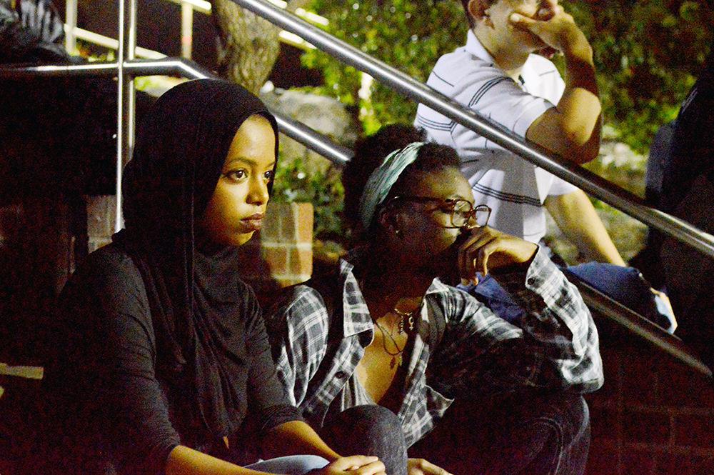 Shima Idries, an NC State alum with a degree in Human Biology and History, and Joelle Fuchs, a fourth-year student majoring in integrative physiology and neurobiology, are watching the 7th Annual Cypher event in motion at the Free Expression Tunnel on Mon, Aug. 28. Students were invited to watch rap battles and other hip-hop performances throughout the night.