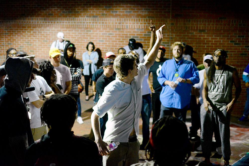 Rapping outside the Free Expression Tunnel at the 7th year anniversary of Cypher Monday, Aug. 28, Anderson Burrus is interrupted by the passing of a train. The crowd, as per tradition, yelled pejoratives towards the nuisance. Burruss was rapping about suicide and called for a moment of silence for Joey Banks.