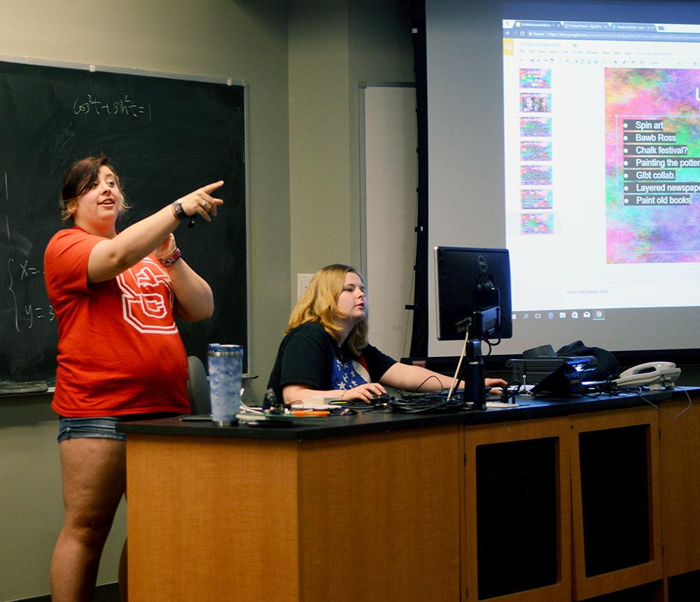 Ashleigh Reed a fouth-year student studying criminology and president of the Canvas Club gathers ideas about future club activities from meeting attendees on Tuesday, Aug. 22 in Dabney Hall. The Canvas Club was just started this past summer and aims to create a space for its members to learn about the different art mediums, meet local artists and participate in art-related events around the Triangle.