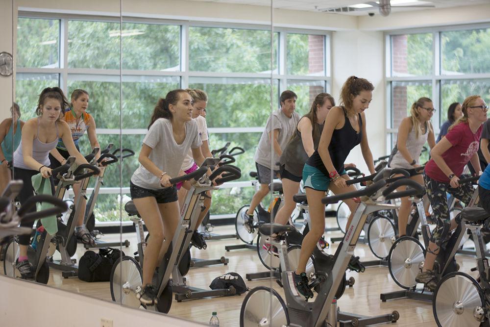 Students power through a cycling class offered by University Wellness and Recreation. This class and many others are hosted weekly at Carmichael Recreation Center.