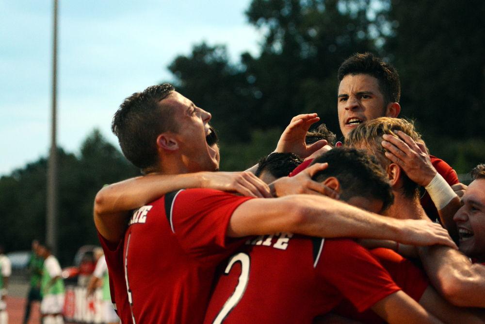 The NC State soccer team celebrates after scoring a goal against the Florida Atlantic Owls. The Wolfpack would go on to win the game 3-2 on Friday, Aug 25 in Dail Soccer Stadium.