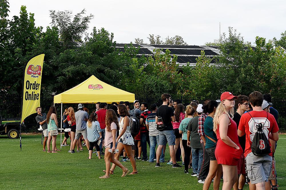 Students wait in line for free slices of Marco's Pizza at this year's RecFest on Sunday, August 13 on Miller Field. Some of the vendors included Dominos Pizza, Moes and Jimmy John's.