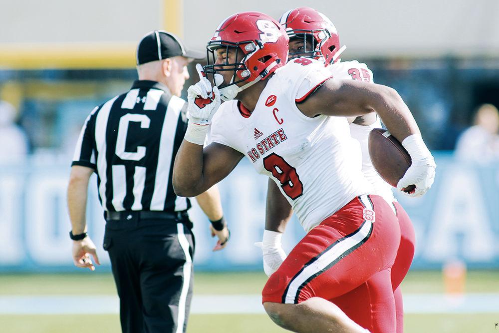 Junior defensive end Bradley Chubb comes away with the fumble recovery in the first quarter setting up the Wolfpack on a short field for a touchdown, taking them to 14-0. The Wolfpack took down the Tar Heels 28-21 in Kenan Stadium on Nov. 25, 2016.