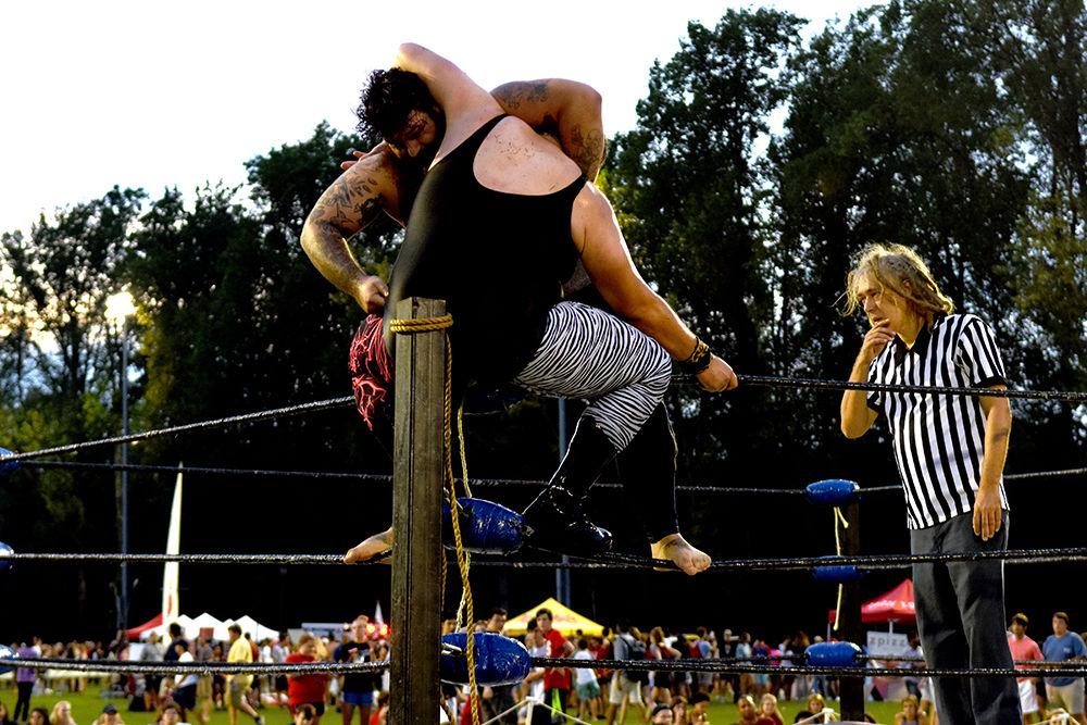 Students watch a live wrestling show at this year's RecFest on Sunday, August 13 on Miller Field. The live show was put on by Gouge Wrestling.