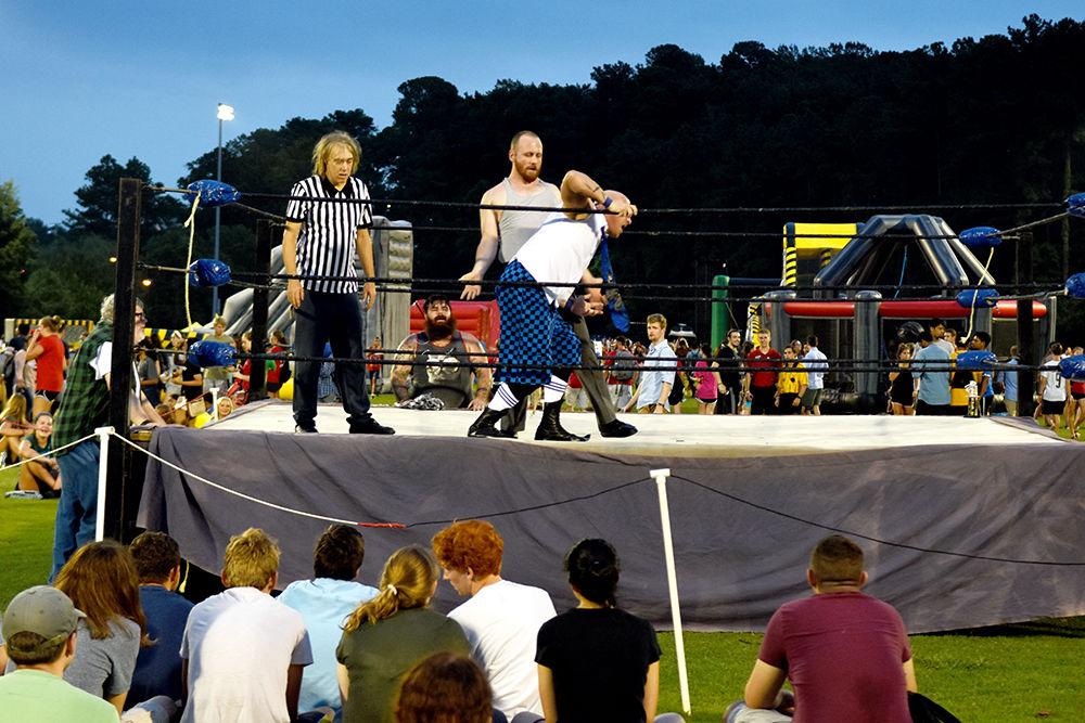 Students watch a live wrestling show at this year's RecFest on Sunday, August 13 on Miller Field. The live show was put on by Gouge Wrestling.