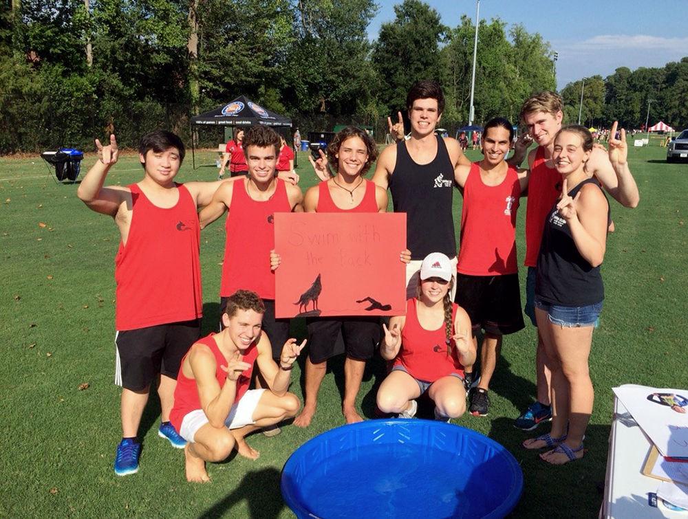 NC State&#8217;s club swim team poses for a group photo by a kiddie pool at Recfest. The team has around four meets per semester, as well as participating in local volunteer work during the season. &#8220;It&#8217;s a good form of exercise, it&#8217;s a great way to meet new people and it&#8217;s a chill environment,&#8221; said club member Neelin Vakil, a fourth-year studying electrical and computer engineering.