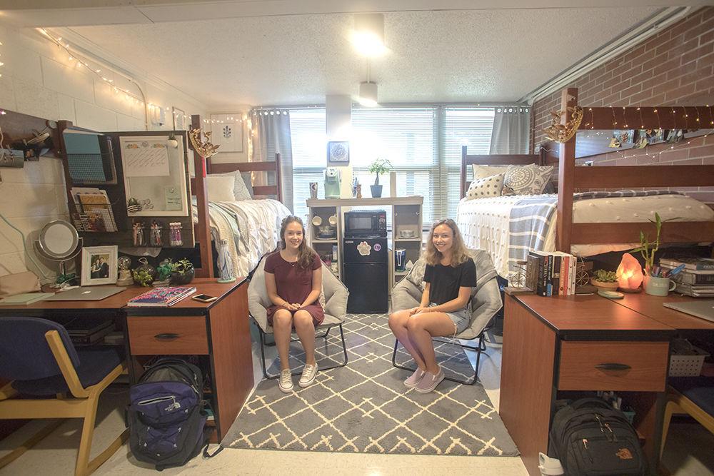 First-years Mackenzie Roach and Alyssa Botkin, studying animal science, show off their trendy room in Bragaw Hall. The two met each other online over the summer and coordinated their room decor through texts and emails. Roach and Botkin won in the Home Sweet Home category in the Wolf Den Design Challenge.