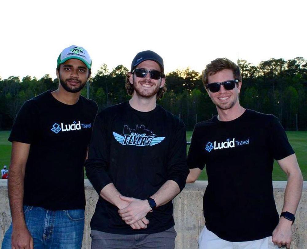 Mishal Pb and Ben Knosby of Lucid Travel watch a Raleigh Flyers game at WakeMed Soccer Park on Thursday, June 8, 2017. Lucid Travel is a travel company in downtown Raleigh that empowers sports teams to raise money through travel. Lucid Travel was founded in November 2015 by two NC State alumni.