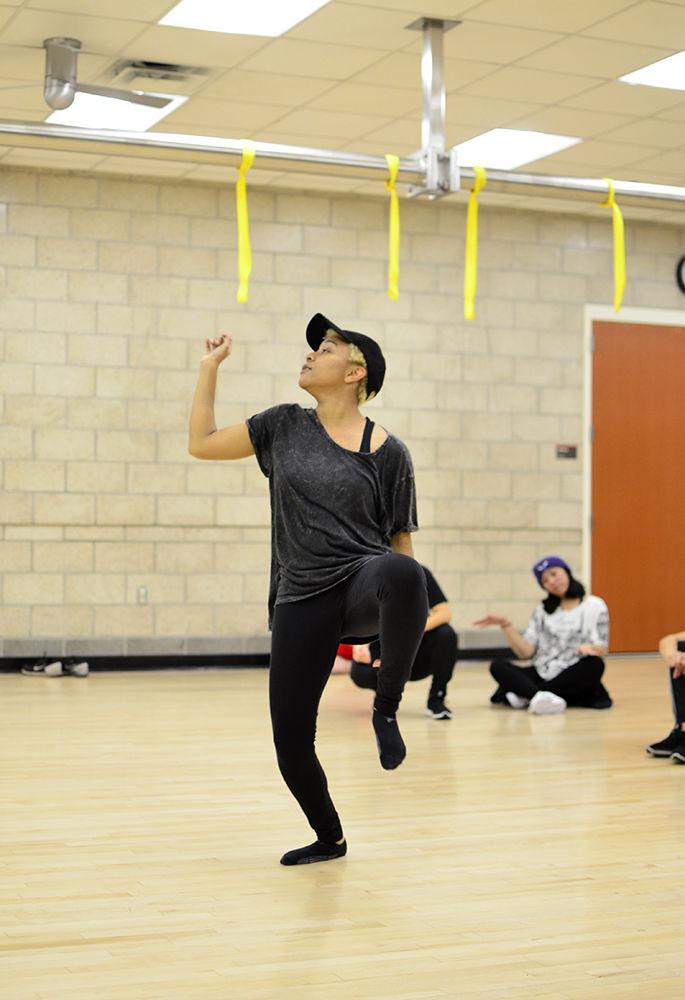 Destinee Gary a fifth-year studying creative writing demonstrates a routine in front of the Just Cuz Crew in Carmichael Recreation Center on Monday.&#160;