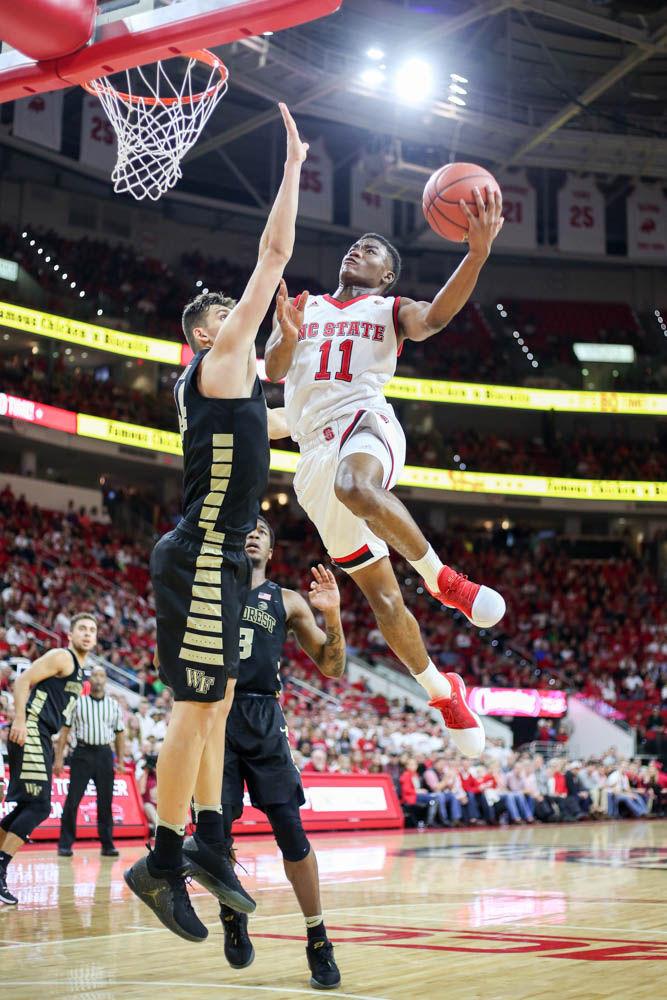 Freshman guard Markell Johnson goes up for a contested layup during the 93-88 loss to Wake Forest on Jan. 21 in PNC Arena.