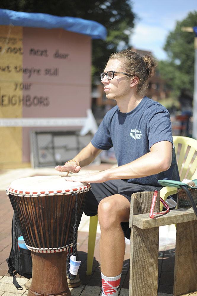 Mason Ward, a first year studying sociology, plays his Djembe for the Global Colors Shack at Shack A Thon in the brickyard on September 21st 2017. The Global Colors Shack had volunteers from both Alexander and Turlington hall, all proceeds went to Habitat for Humanity.