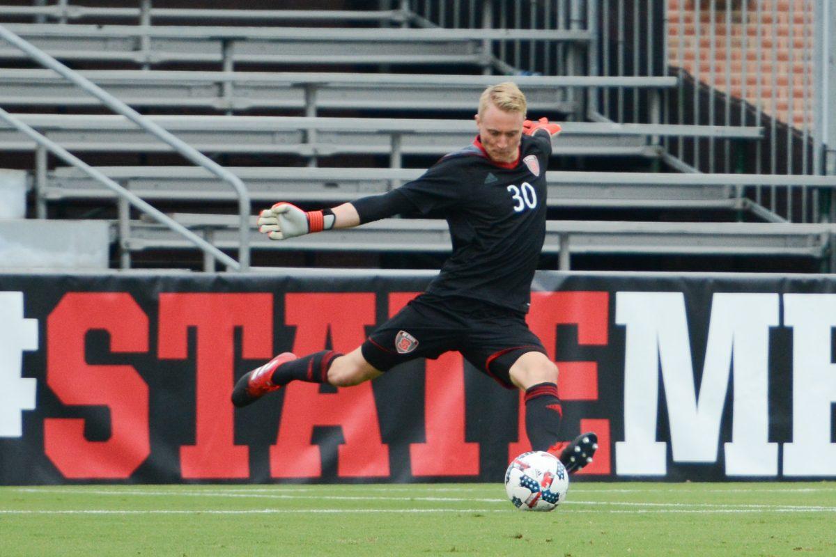 Freshman goalkeeper Leon Krapf kicks the ball towards center field. At the time this photo was taken the NC State men's soccer team was winning 1-0 against LIU Brooklyn at Dail Soccer Stadium on Friday, Sep. 1 until the game was suspended due to inclement weather.