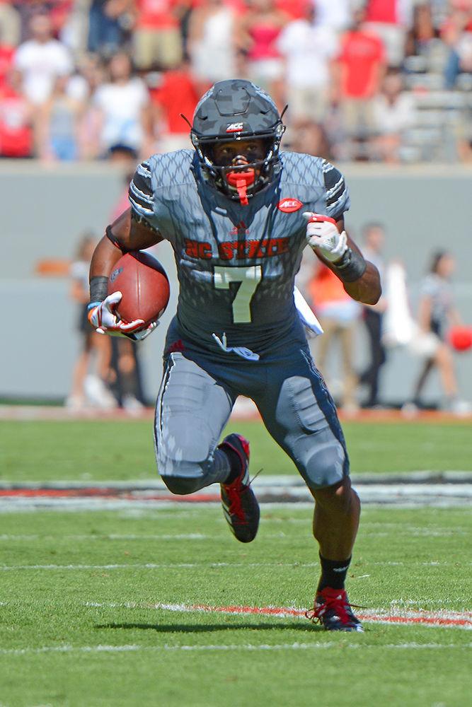 Junior running back Nyheim Hines sprints across the field. The NC State football team beat Syracuse 33-25 at Carter-Finley Stadium on Saturday.
