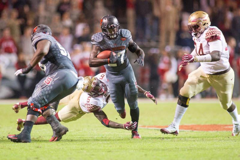 Redshirt junior running back Dakwa Nichols breaks a tackle for a big gain. Nichols had 12 yards on two attempts during the 24-20 loss to Florida State on Saturday in Carter-Finley Stadium.