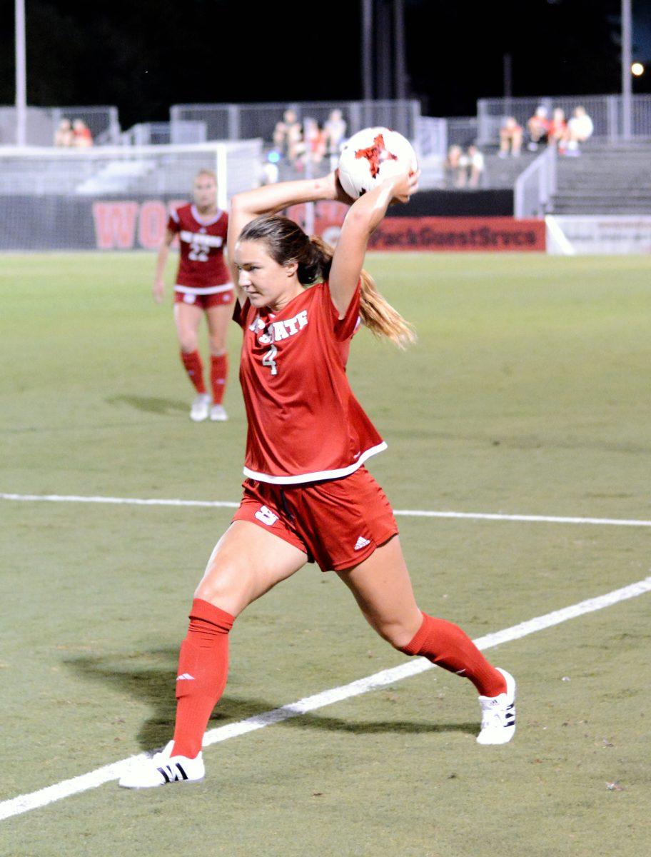 Junior defender Hannah Keogh throws the ball in. The NC State women's soccer team tied Virginia 0-0 in double overtime at Dail Soccer Stadium on Friday, Sep. 15.