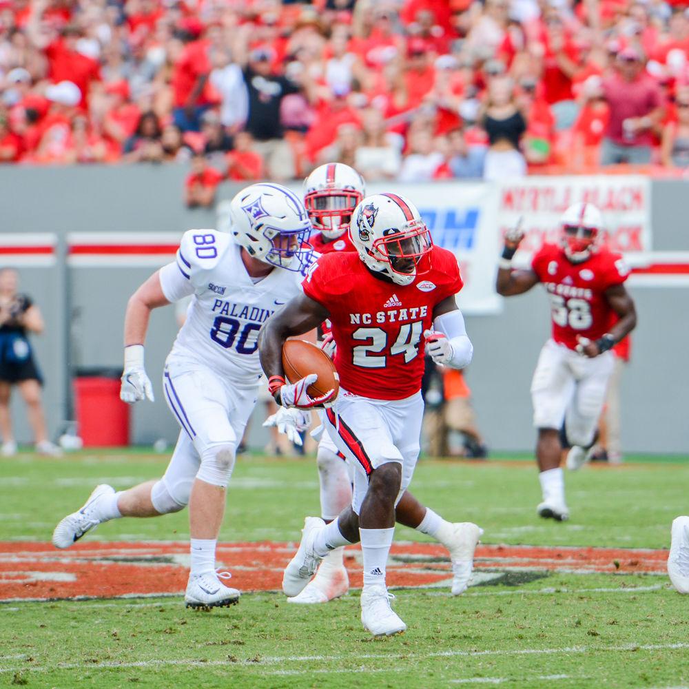 Senior Safety Shawn Boone intercepts the ball and returns it for a touchdown in the 3rd quarter. When asked about his speed in intercepting the pass and returing it for a touchdown, Boone credits Coach Thunder. The NC State Football Team beat Furman 49-16 on Saturday, September 16th.