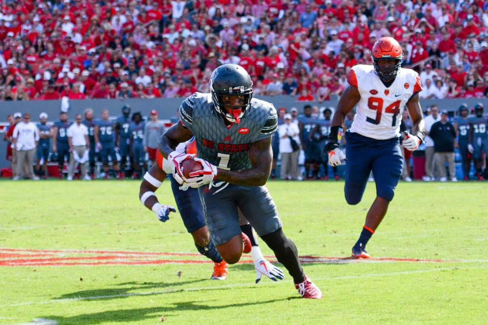 Senior H-back Jaylen Samuels breaks away from two Syracuse players. Samuels received five passes during the game for a net gain of 37 yards. The NC State football team beat Syracuse 33-25 at Carter-Finley Stadium on Sep. 30.