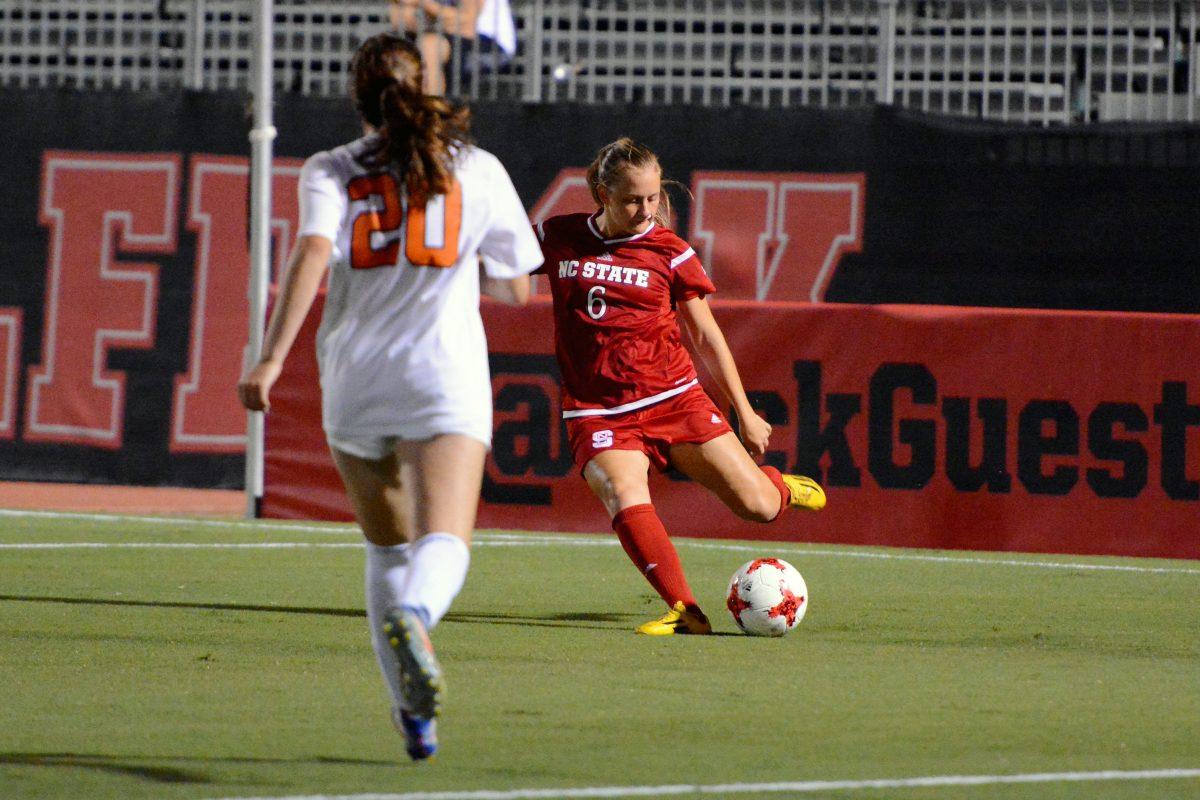 Freshman defender Lulu Guttenberger winds back to pass during the game against Virginia in Dail Soccer Stadium. The Cavaliers and the Wolfpack tied 0-0 on Friday, Sept 15.