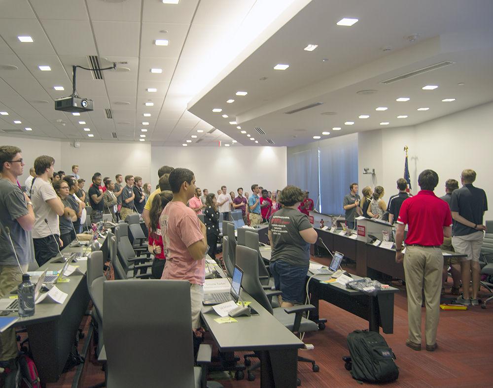 Senators stand for the Pledge of Allegiance at the first Student Senate meeting of the fall semester.