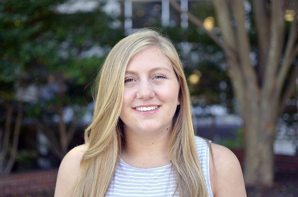 Emma Carter is a second-year studying criminology and international studies sits in front of Dabney Hall on Wednesday. A delegate with the Association of Student Government (ASG), Carter said, "My goal this year is to inform the students about ASG and how they can get involved."&#160;