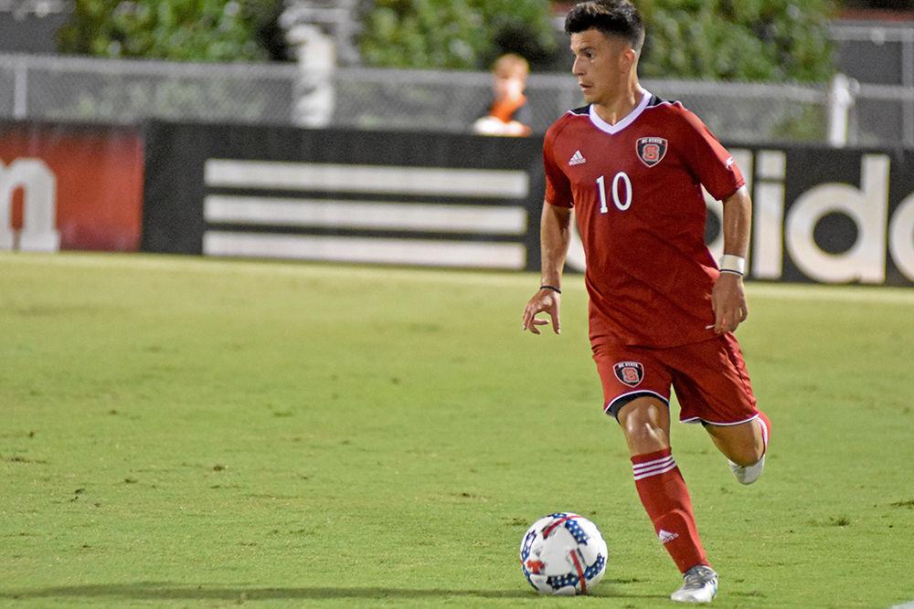 David Loera, a freshman forward, looks to pass during the game against UNC Asheville. The Wolfpack, thanks to Loera's 2 assists, won 3-0 in Dail Soccer Stadium on Tuesday.