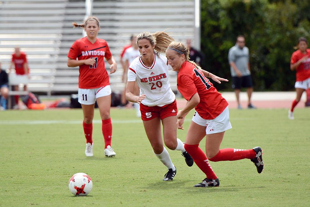 Redshirt-Senior forward Rachel Cox sprints forward to take the ball from a Davidson player. The NC State women's soccer team beat Davidson 4-0 at Dail Soccer Stadium on Sunday, Sept. 10.