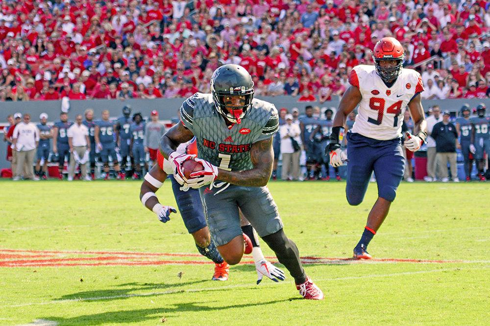 Senior H-back Jaylen Samuels breaks away from two Syracuse players. Samuels received 5 passes during the game for a net gain of 37 yards. The NC State football team beat Syracuse 33-25 at Carter-Finley Stadium on Saturday.