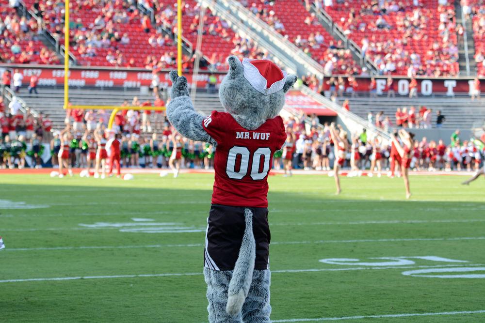 Mr. Wuf cheers with the crowd before kickoff in the heart of Carter-Finley Stadium. The game was held on Saturday, Sept 9, and the Wolfpack came away with a 37-20 victory over Marshall's Thundering Herd.