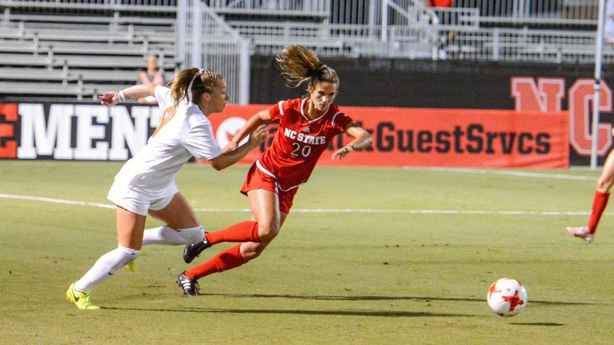 Redshirt-Senior forward Rachel Cox sprints forward to keep the ball from a Virginia player. The NC State women's soccer team tied Virginia 0-0 in double overtime at Dail Soccer Stadium on Friday, Sep. 15.