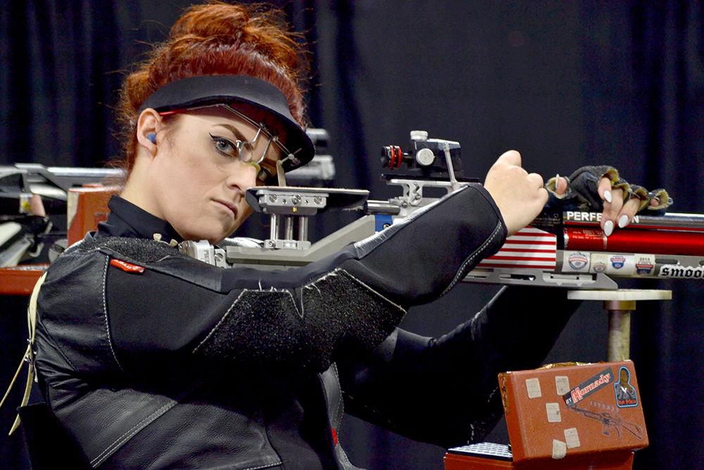 Lauren Phillips, a graduate student studying social work, reloads her air rifle during the individual air rifle elimination tournament during the NC State rifle match against West Virginia on Oct. 15 in Reynolds Coliseum. The Wolfpack lost against the Mountaineers during the tournament with a score of 15-21.