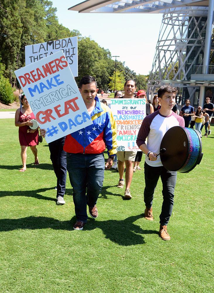 A group of protesters led by Miguel Migliore, a fourth-year studying computer science, and Didier Turcios, a fourth-year studying statistics, march in support of DACA at Stafford Commons on Friday. The protestors chanted, "We will not go away. Dreamers are here to stay," and "Show me what democracy looks like. This is what democracy looks like," while marching around the lawn as well as through the second floor of Talley Student Union to voice their opinion against the Trump administration's recent controversial planned ending of the program.