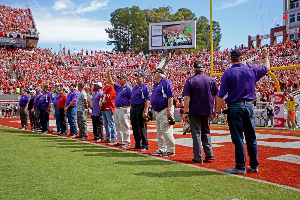 Veterans awarded with the purple heart accommodation are honored during a break in the game. The NC State football team beat Syracuse 33-25 at Carter-Finley Stadium on Saturday.
