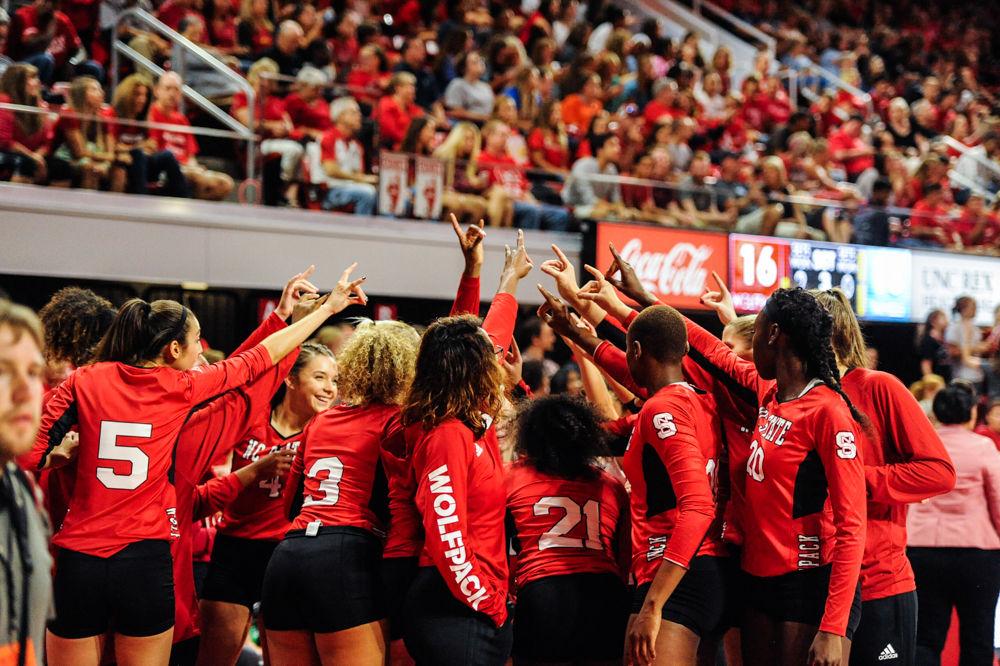 Hundreds gathered around in Reynolds Coliseum to witness the NC State Women&#8217;s Volleyball Team host #11 UNC. The team gathered during a timeout. The NC State Women&#8217;s Volleyball Team went on to defeat #11 UNC 3 - 2.