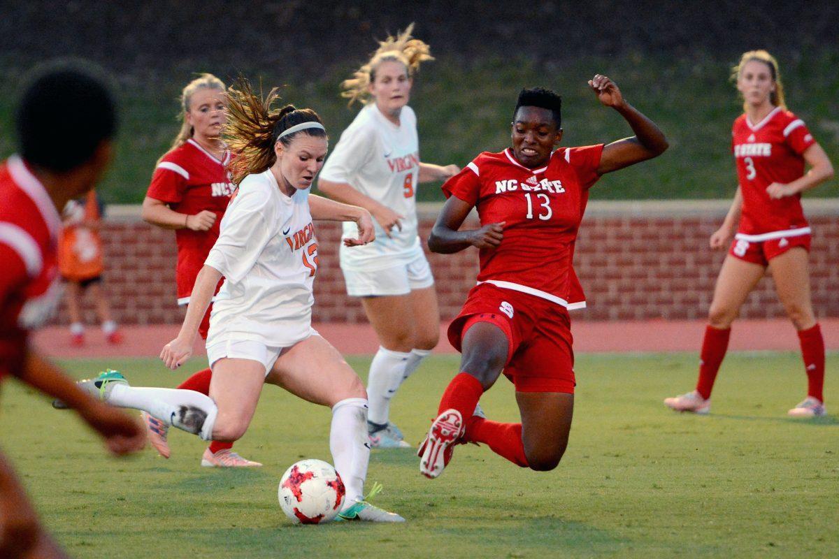 Junior defender Ella Bonner jumps into a slide tackle during the game against Virginia. The Wolfpack would go on to tie the Cavaliers 0-0 in Dail Soccer Stadium on Friday, Sept. 15.